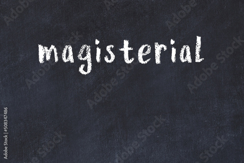 Fotografía College chalk desk with the word magisterial written on in
