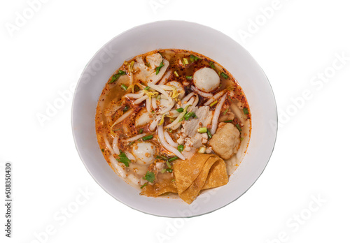 Spicy silver needle noodle chinese soup or Spicy silver pin noodle chinese soup (Tom yum giam ii soup) with fish balls, shrimp meatballs,  pork, steamed ground pork, fried wonton, ground peanut and gr