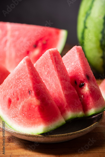 fresh sliced watermelon fruit on wooden  background photo