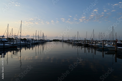 Suummer cloudscape reflected in tranquil water of Dinner Key Marina in Coconut Grove, Miami, Florida. © Francisco