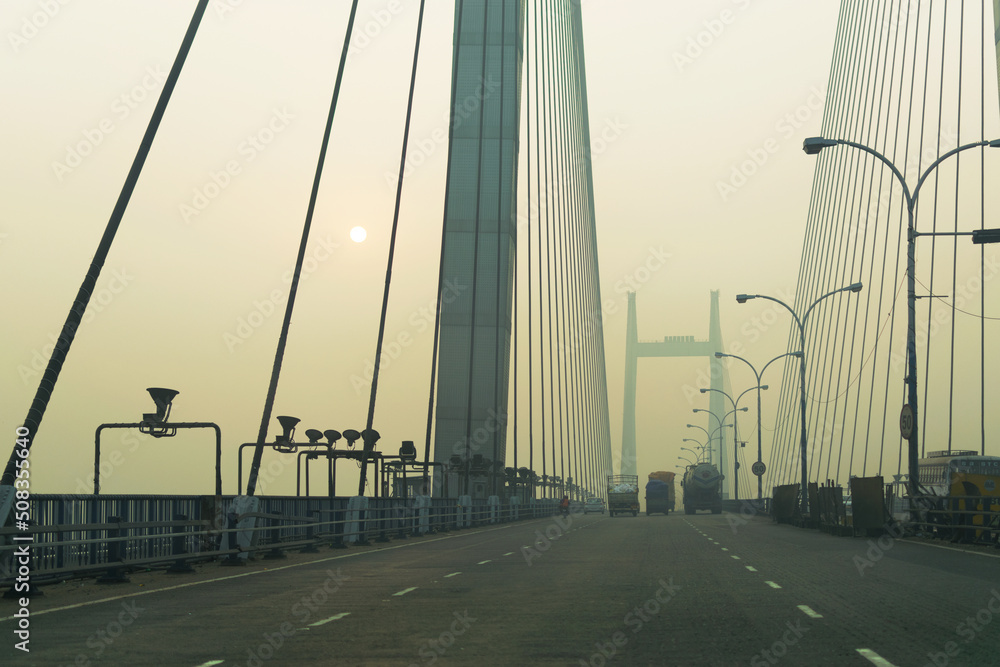 Obraz premium Vidyasagar Setu (Bridge) over river Ganges, 2nd Hooghly Bridge in Kolkata,West Bengal,India. Shot in winter morning. Connects Howrah and Kolkata, Longest Cable - stayed bridge in India.