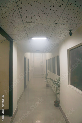 Kolkata, West Bengal, India - 21st June 2020 : An Office corridor after sanitization spray used, sanitizing smoke filled the air. Sanitizaer used to fight the spead of novel corona virus.
