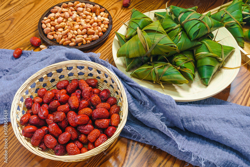 Chinese traditional festival Dragon Boat Festival, Zongzi and ingredients on the table photo