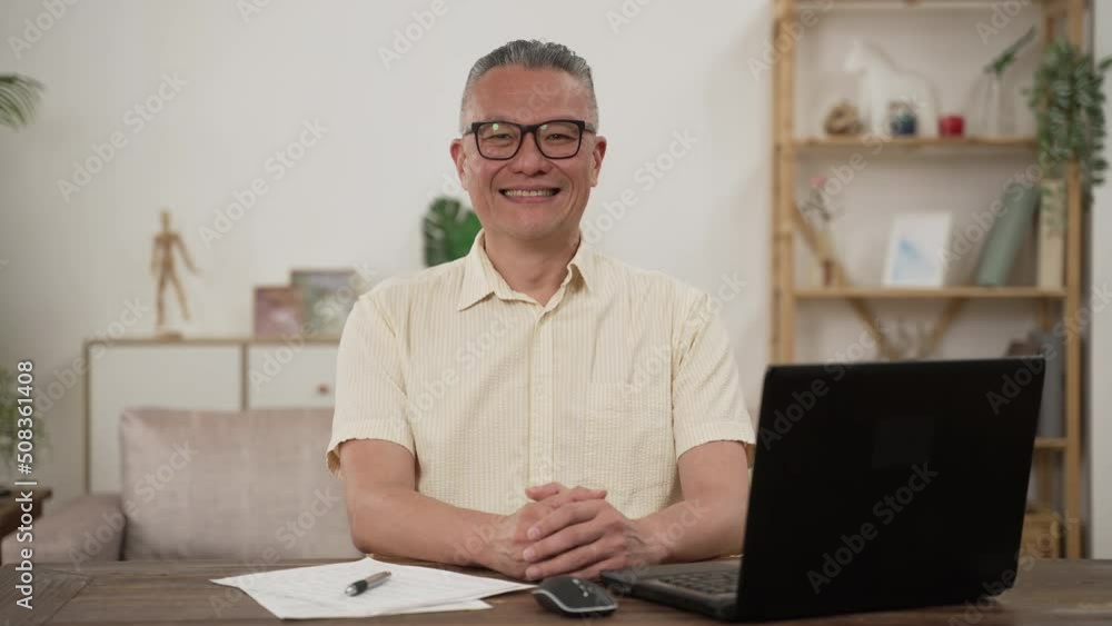 half length portrait of a old grey haired Asian businessman pensioner in casual wear looking at camera with serious face expression work from home. half length portrait of a old grey haired Asian businessman pensioner in casual wear looking at camera with serious face expression work from home.