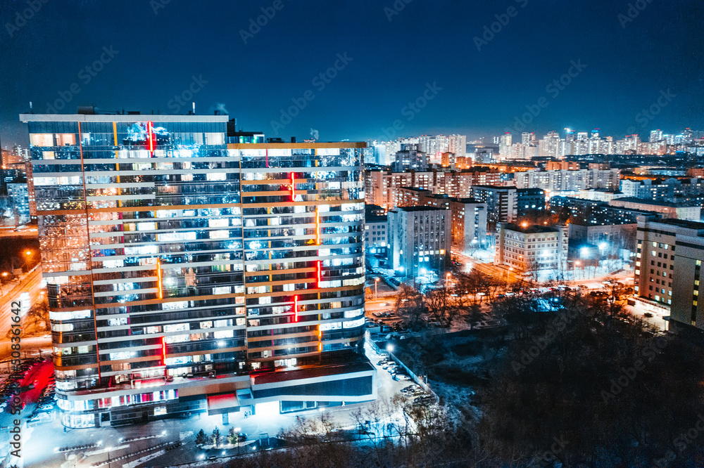 Fototapeta premium Top view of the night modern city. Bright lights of the night streets. Ekaterinburg. Russia