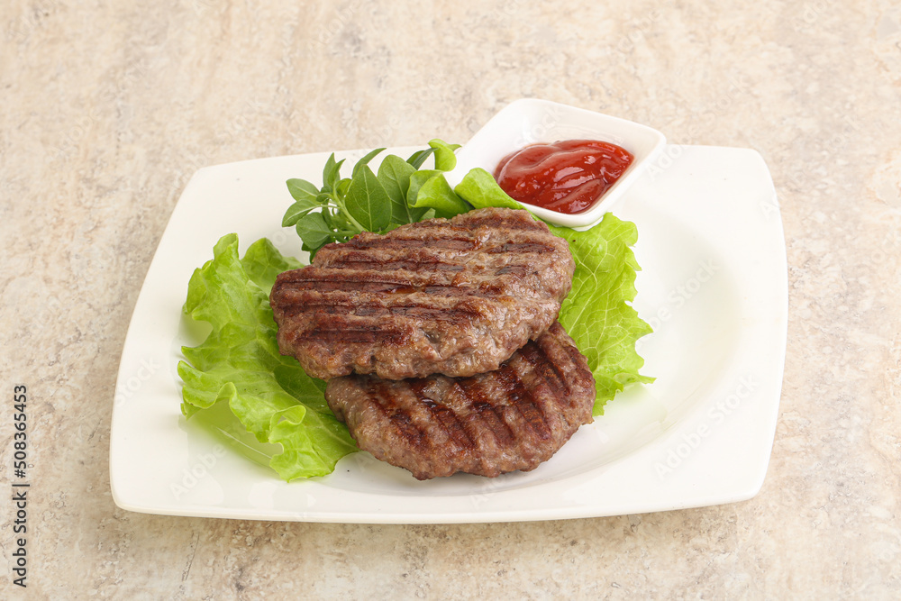 Grilled beef burger cutlet with sauce Grilled beef burger cutlet with sauce