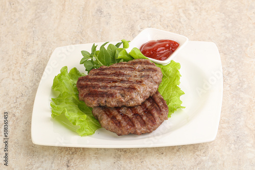 Grilled beef burger cutlet with sauce