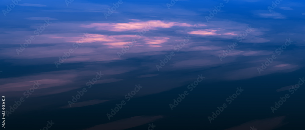 Fototapeta premium Panoramic view of a pink and blue sky at sunset. Clouds with sky panorama background.