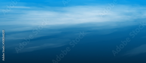 Blue sea with waves and sky with clouds
