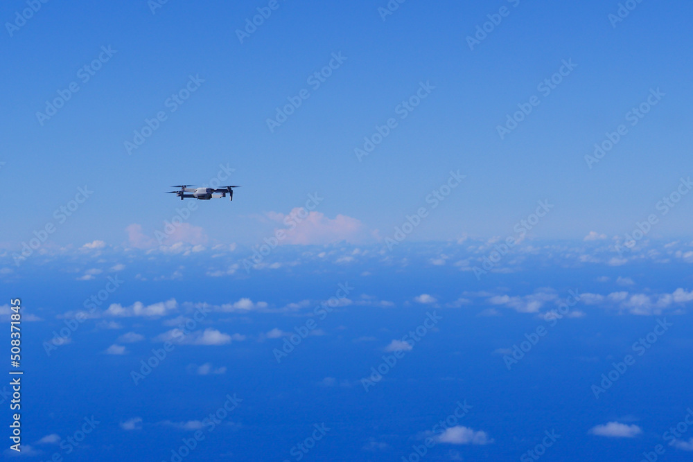 Fototapeta premium Drone protection flying during the day in blue sky, High quality photo
