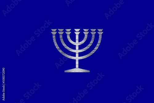 Silver Hebrew menorah jewish sacred symbol on a canvas colored in blue national background  jewish candlestick  sacral eternal flame  israel