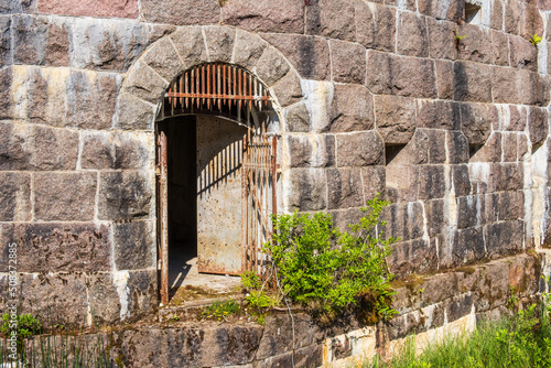 Old rusty Iron gate in a fortified wall