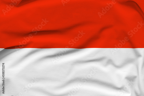Indonesia national flag  folds and hard shadows on the canvas
