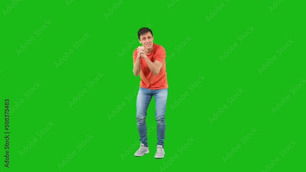Upset man supplicating in studio against chroma key Upset man supplicating in studio against chroma key