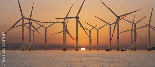Obraz na płótnie Offshore wind farm during sunrise w salonie