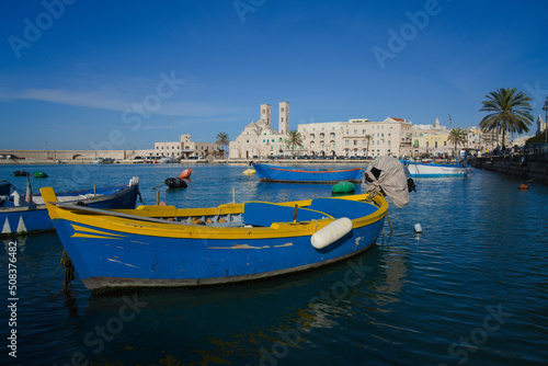 Molfetta, Puglia, Italy, view of the beautiful harbor with the typical colored boats.                           