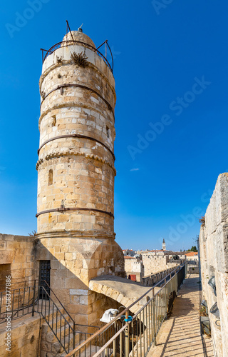 Ottoman minaret above walls and archeological excavation site of Tower Of David citadel stronghold in Jerusalem Old City in Israel photo