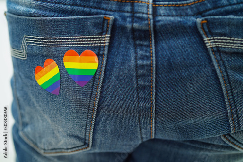 Asian woman with rainbow flag, LGBT symbol rights and gender equality, LGBT Pride Month in June.