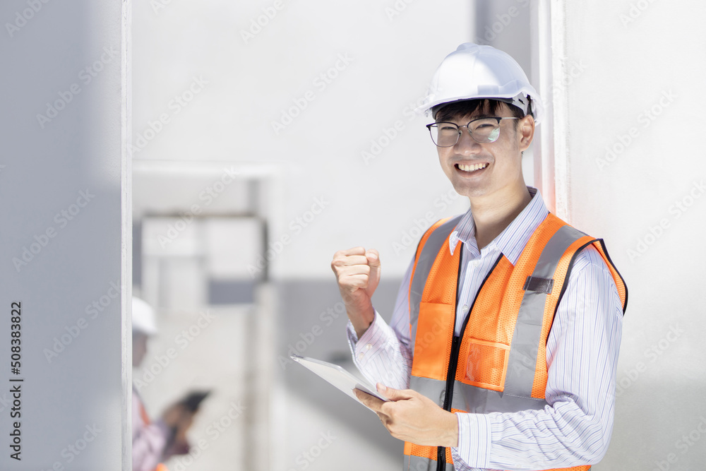 A portrait of an industrial man and woman asia engineer with tablet in a site home, working.