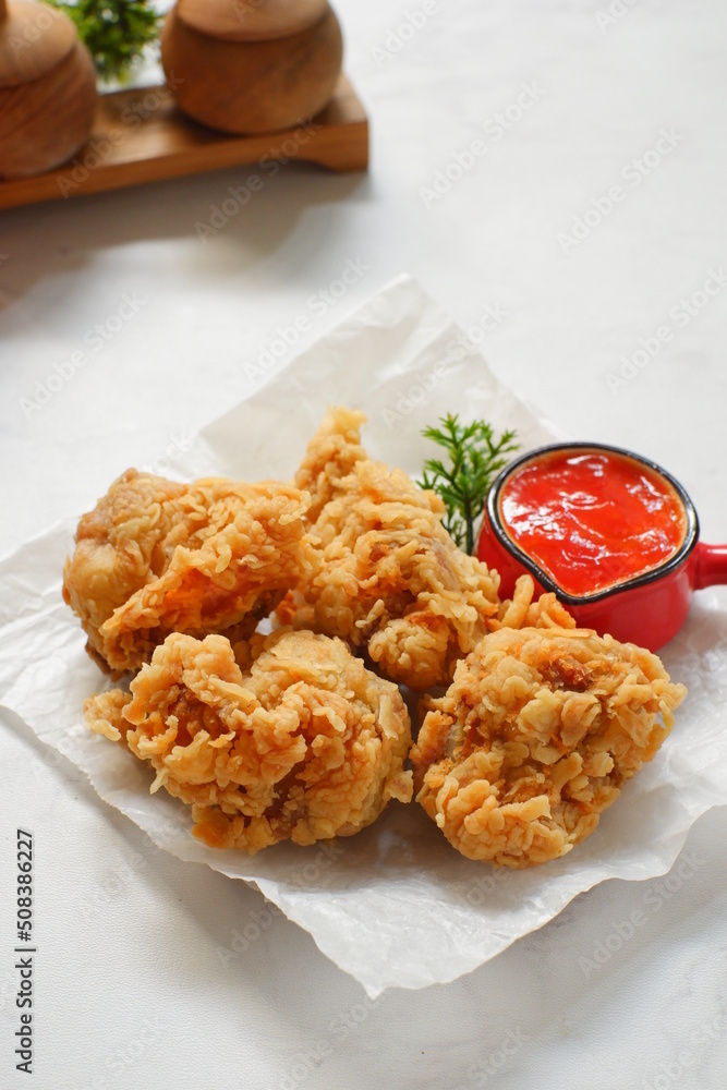 a plate of fried chicken in white background a plate of fried chicken in white background