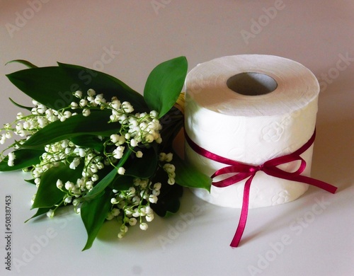 Toilet paper with flowers. Lily of the valley toilet paper. Toliet paper - decoration. Scented toilet paper.  © Mary