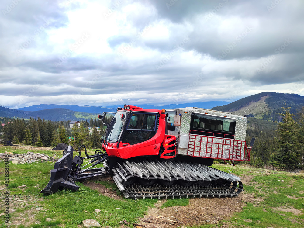 Ratrak, ratrac, snowcat or snowplow machine at snowy ski resort Ratrak, ratrac, snowcat or snowplow machine at snowy ski resort