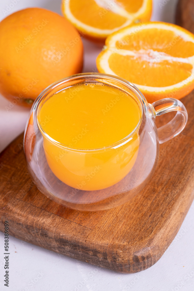 Freshly squeezed orange juice on a white background. Fresh orange juice. close up Freshly squeezed orange juice on a white background. Fresh orange juice. close up