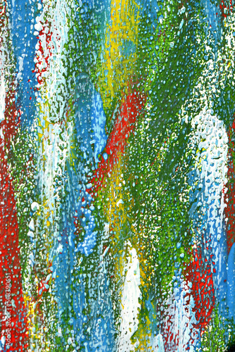 Creative background of colorful brush strokes on canvas closeup. Abstract art background from smeared brush strokes of green red white blue yellow colors macro. Drawing painting paint texture backdrop