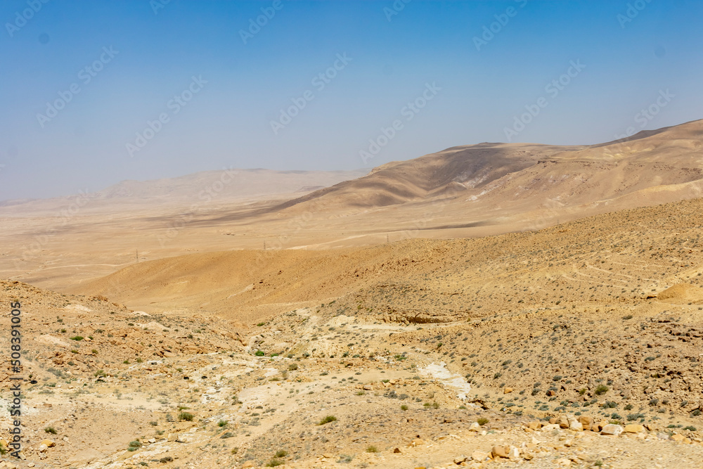 Wadi Musa, Jordan - June 7 2019: Glimpse of the arid Jordanian landscape Wadi Musa, Jordan - June 7 2019: Glimpse of the arid Jordanian landscape