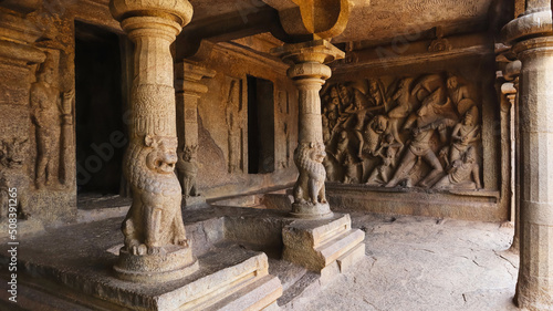 Mahishasuramardini cave interior, Lion pillars and panel of Durga attacking the buffalo demon on right, Mahabalipuram, Tamil Nadu, India