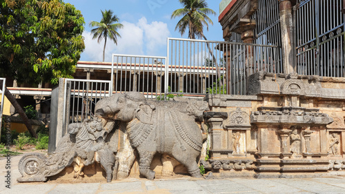 Dilapidated sculpture of Elephant and man with horse, War Scene on Staircase of Temple, Nataraja Temple, Chidambaram, Tamilnadu, India photo