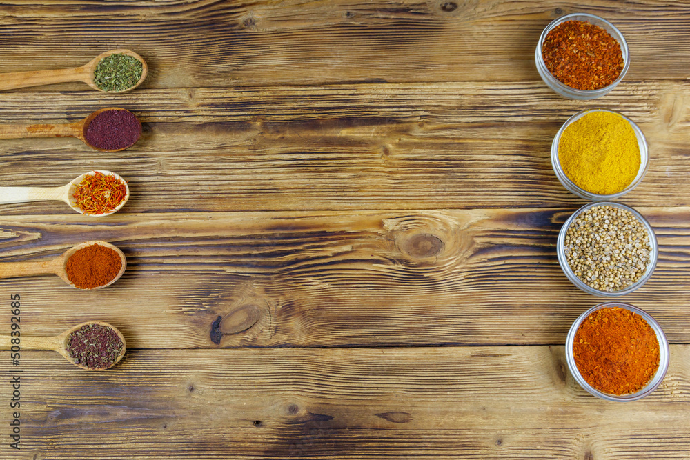 Set of different aromatic spices on wooden table. Top view, copy space Set of different aromatic spices on wooden table. Top view, copy space