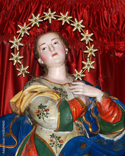 The Immaculate Virgin with the crown of 12 stars according to the Apocalypse description inside the Church of Saint Biagio in Serra San Bruno (Calabria) photo