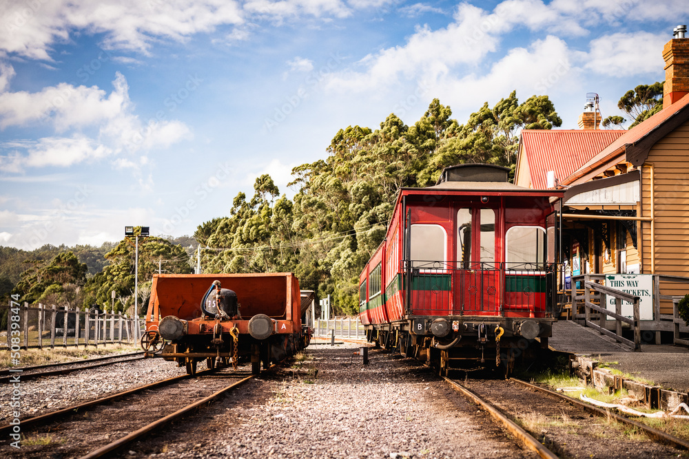 Obraz premium red train carriages at old station tasmania