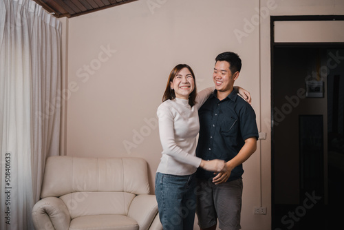 Asian young man and girlfriend get surprise after renovate living room for her gift.