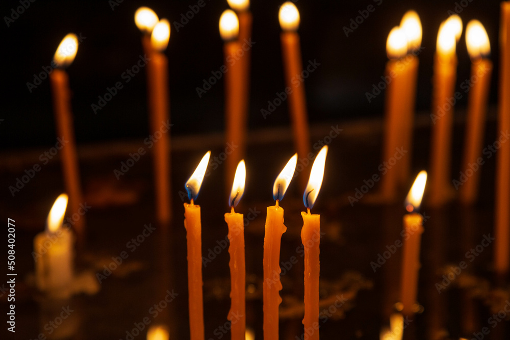 Candles burning in the Armenian orthodox church at Geghard monastery near Garni, Unesco World Heritage Site, Kotayk region, Armenia Candles burning in the Armenian orthodox church at Geghard monastery near Garni, Unesco World Heritage Site, Kotayk region, Armenia