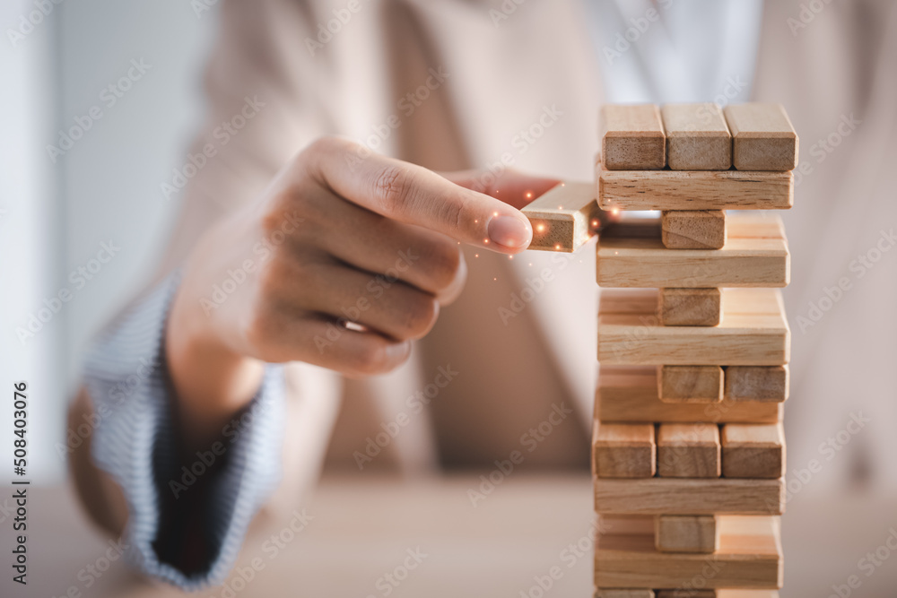 closeup hand playing wooden block tower closeup hand playing wooden block tower