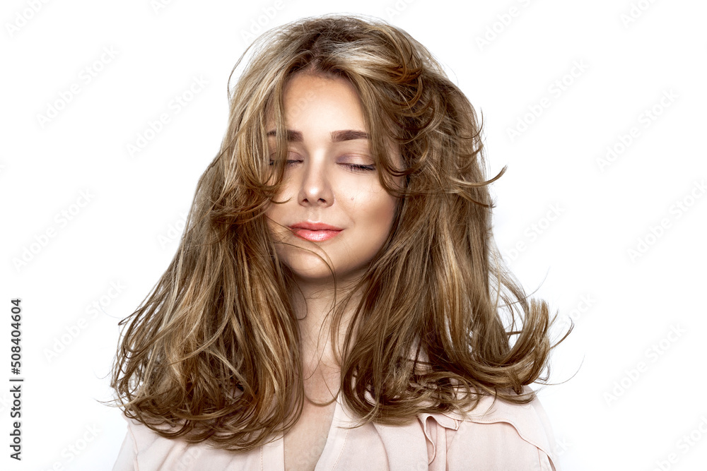 Portrait of a beautiful natural girl with beautiful healthy hair on a white background. A beautiful young girl with a perfect face and beautiful flowing hair. Beauty hair - concept. Portrait of a beautiful natural girl with beautiful healthy hair on a white background. A beautiful young girl with a perfect face and beautiful flowing hair. Beauty hair - concept.