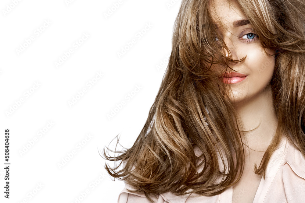 Portrait of a beautiful natural girl with beautiful healthy hair on a white background. A beautiful young girl with a perfect face and beautiful flowing hair. Beauty hair - concept. Portrait of a beautiful natural girl with beautiful healthy hair on a white background. A beautiful young girl with a perfect face and beautiful flowing hair. Beauty hair - concept.