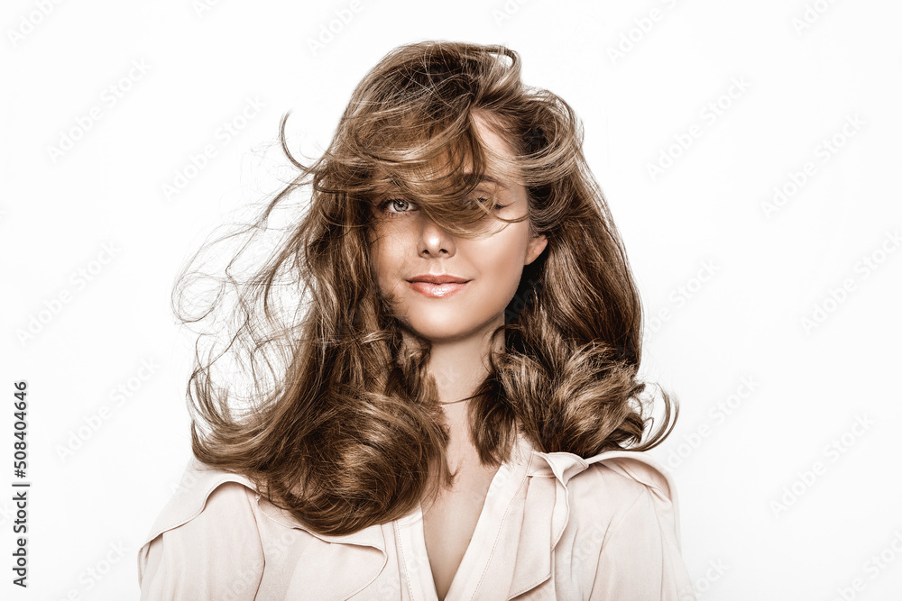 Portrait of a beautiful natural girl with beautiful healthy hair on a white background. A beautiful young girl with a perfect face and beautiful flowing hair. Beauty hair - concept. Portrait of a beautiful natural girl with beautiful healthy hair on a white background. A beautiful young girl with a perfect face and beautiful flowing hair. Beauty hair - concept.