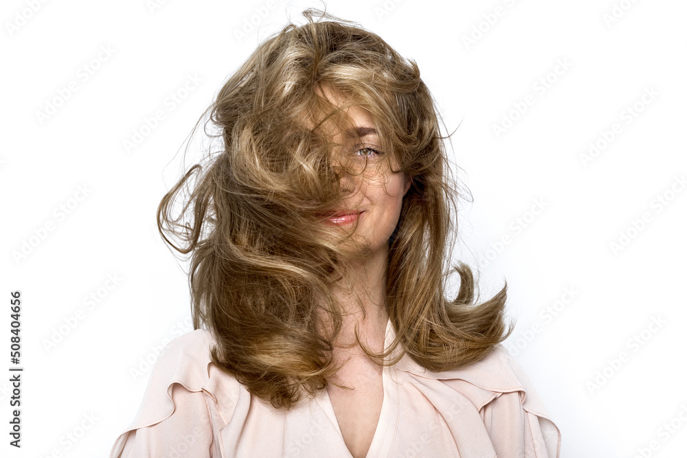 Portrait of a beautiful natural girl with beautiful healthy hair on a white background. A beautiful young girl with a perfect face and beautiful flowing hair. Beauty hair - concept. Portrait of a beautiful natural girl with beautiful healthy hair on a white background. A beautiful young girl with a perfect face and beautiful flowing hair. Beauty hair - concept.