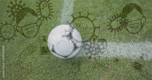 Coronavirus concept icons against soccer ball on sports field