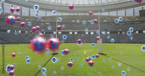 Image of covid 19 cells over empty rugby pitch sports stadium