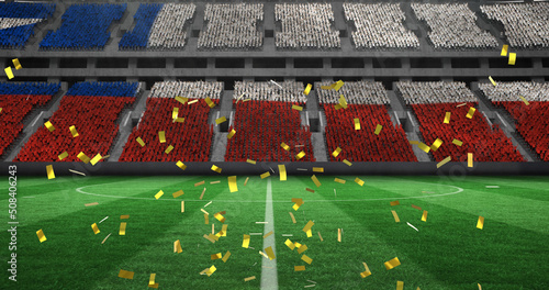 Image of confetti falling over chilean flag in empty sports stadium