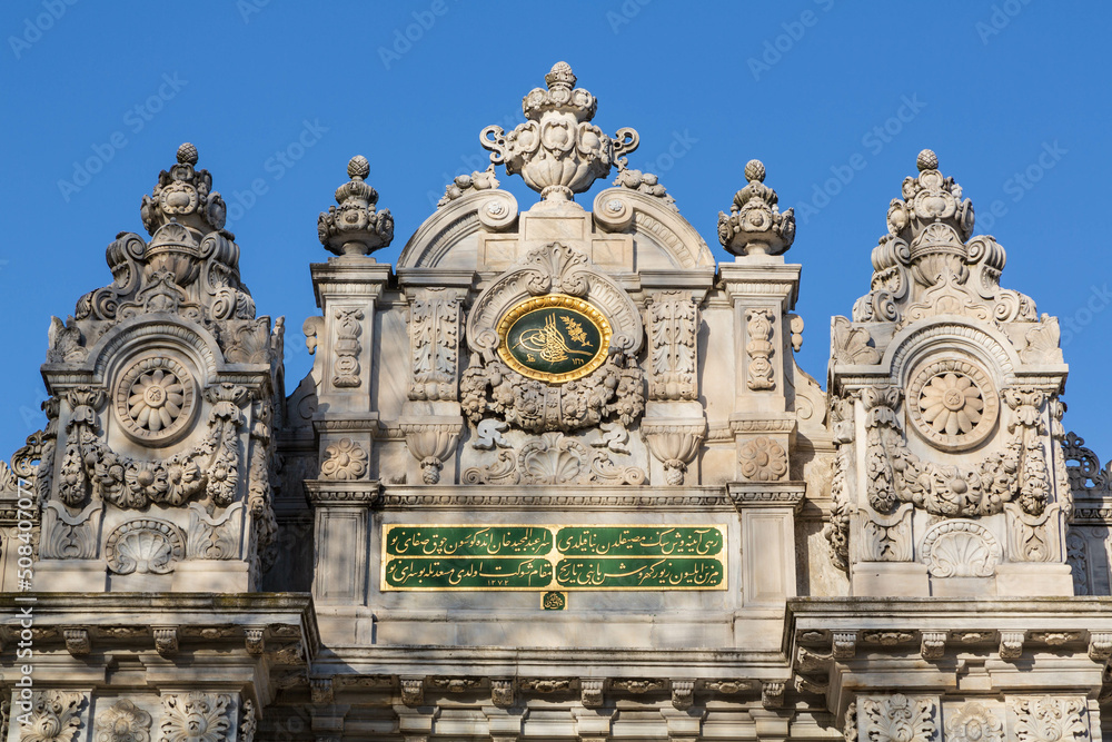 ISTANBUL, TURKEY - April, 2022. Dolmabahce Palace. Detail of the facade of the Gate of the Sultan on Dolmabahce Avenue. Besiktas district, city of Istanbul, Turkey.
