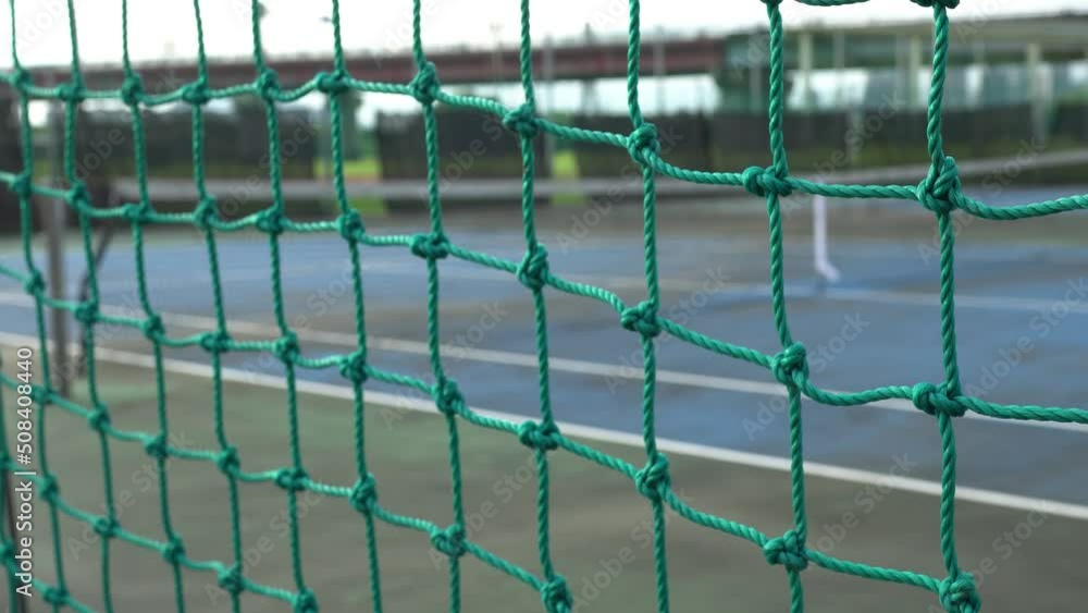 Old tennis court outdoors.