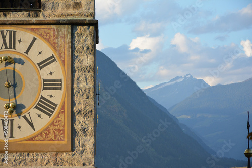 Old bell tower with clock, Rainkirche/Chiesa Santa Caterina, Bruneck/Brunico, South Tirol, Italy photo