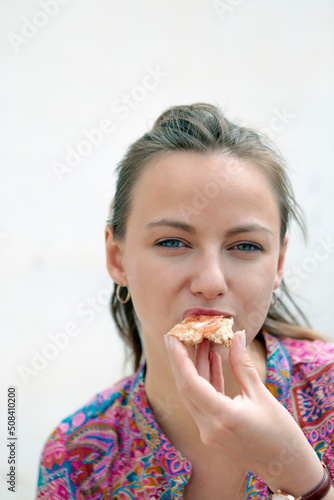 close-up of woman biting toast on bar terrace