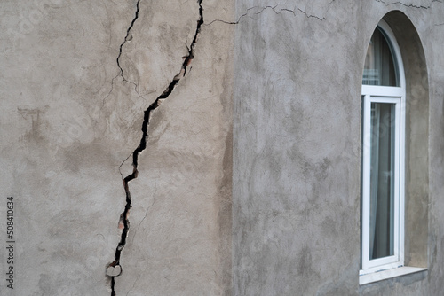 Closeup of cracked wall of house destroyed during strong earthquake in Tbilisi Georgia. Damage on buiding. 