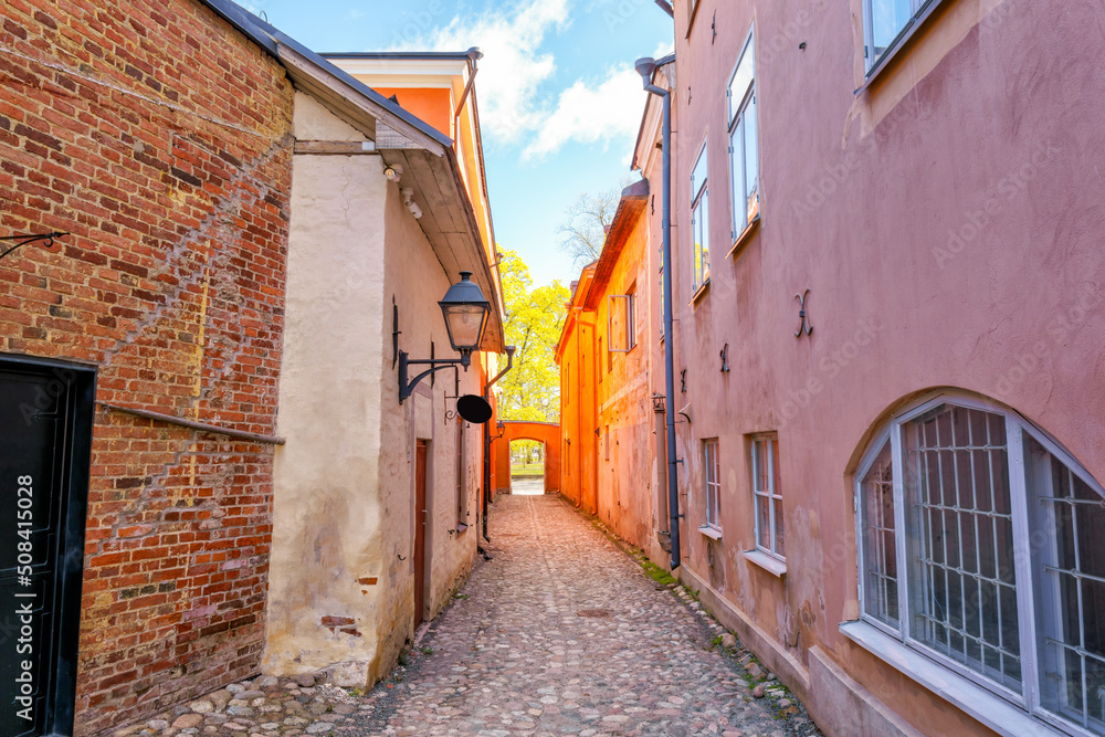 Fototapeta premium Medieval narrow alley in Turku, Finland called Luostarin välikatu. It used to lead from the monastery to the city centre and the cathedral.